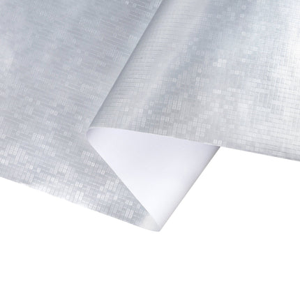Folded silver grid wrapping paper: durable, sharp texture for stylish holiday gifting.