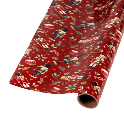 Festive reversible wrapping paper with traditional nutcracker motif on red base and gold foil holly scroll