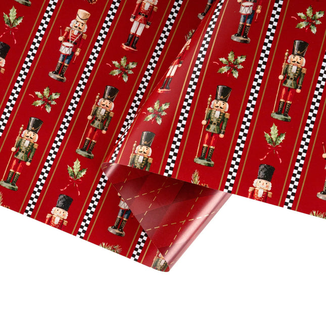 Double-sided festive gift wrap featuring classic nutcracker holly print and shiny metallic red argyle