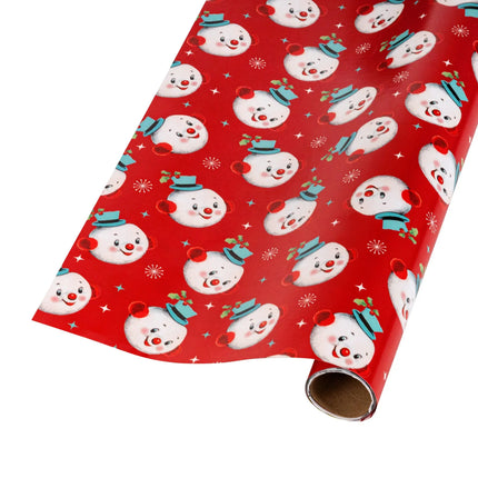 Vintage-style double-layer gift wrap pairing playful snowman face print and varied colorful snowflake design