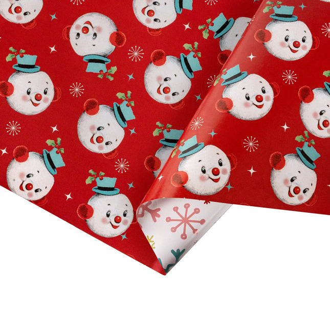 Double-sided festive gift wrap featuring cute vintage snowman head design and multi-hued classic snowflake pattern