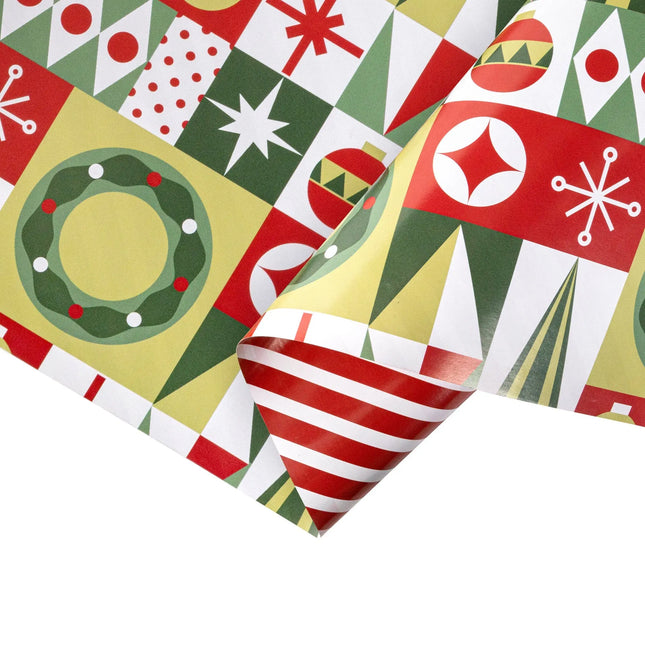 Double-sided festive wrapping paper featuring block-style geometric wreath/tree ornament art and bold red white stripe