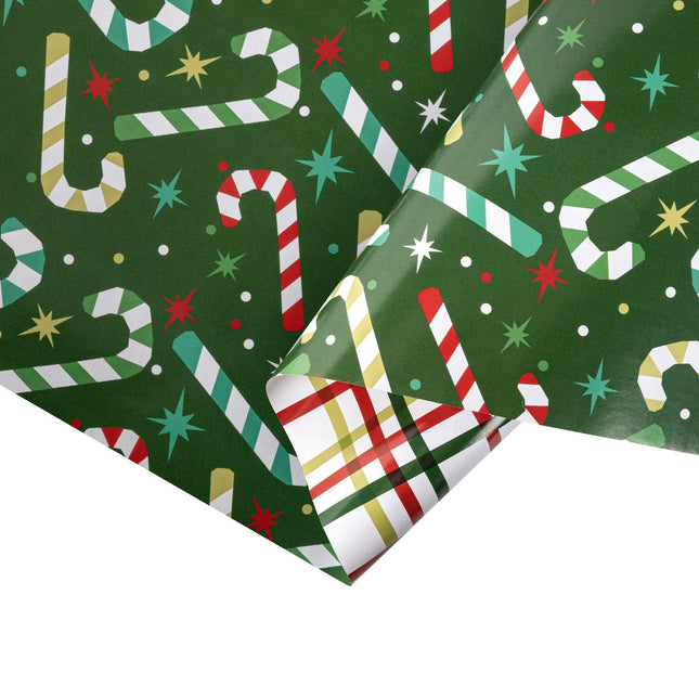 Double-sided festive gift wrap featuring colorful candy cane star pattern and traditional tartan plaid