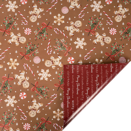 30"x10' reversible Christmas wrap with gingerbread men, peppermints and holly print front, plus "Merry Christmas" script on red reverse