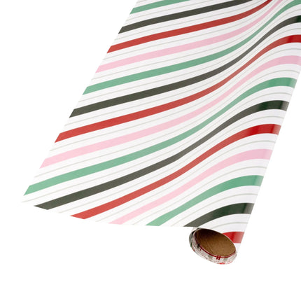 Reversible Xmas paper with bold mixed pastel stripes on one side and assorted candy cane designs on the other
