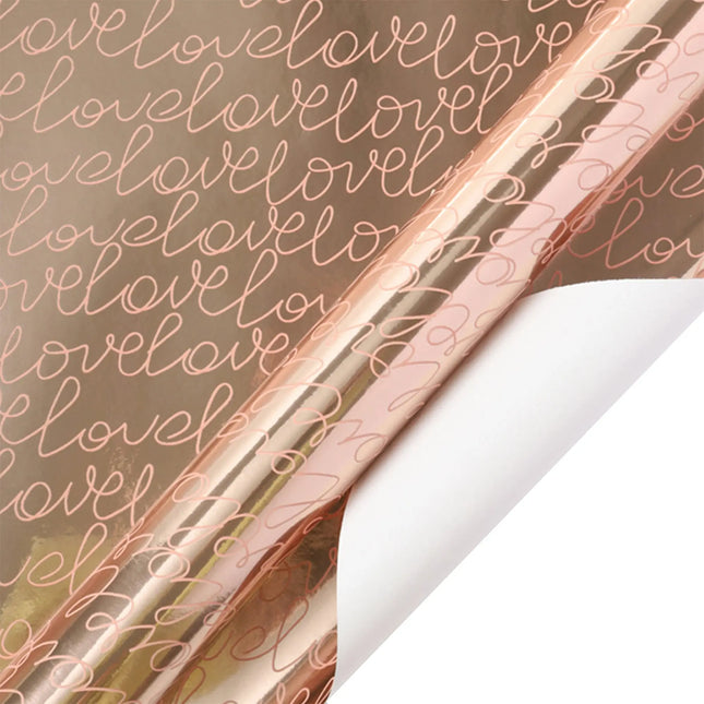 Rose gold metallic wrapping paper with script “love” (white back); gift wrapping.