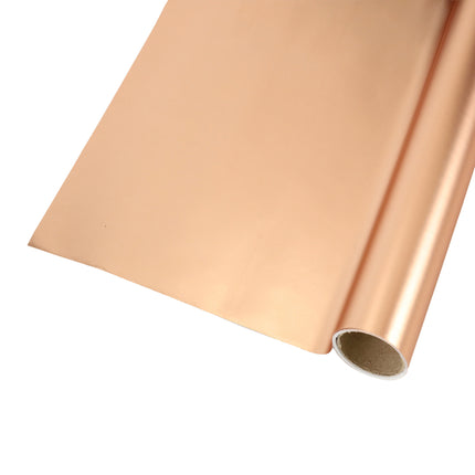 Roll of rose gold matte wrapping paper; gift packaging.