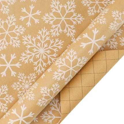 Kraft Christmas wrapping paper with printed white snowflake pattern and grid marking on reverse side