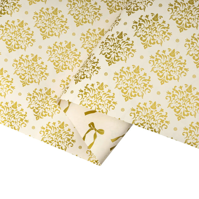Two-sided metallic holiday paper combining intricate gold damask artwork and glossy gold bow motif