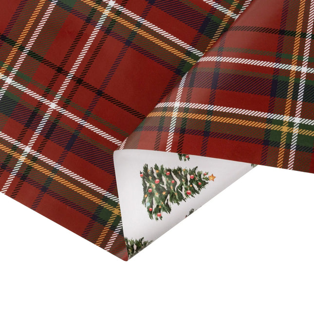 Two-sided holiday wrapping paper combining timeless tartan plaid and charming decorated tree prints