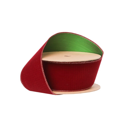 Reversible Christmas ribbon: rich red velvet & green, neat stitching, luxurious texture for holiday decor.