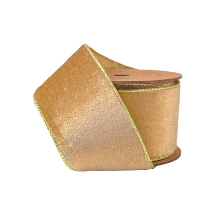 A roll of 2 1/2" gold velvet wired ribbon, plush texture with gold trim, ideal for luxurious holiday decor and crafting.