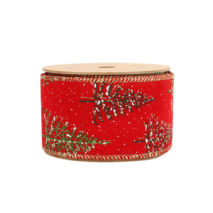 The red ribbon featuring snow-covered Christmas trees, falling snow, and gold-edged stitching, ideal for holiday decor.