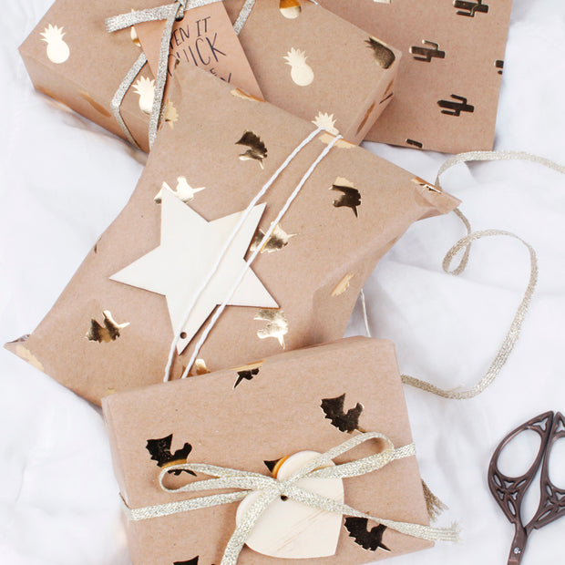 Brown kraft gold foil printed wrapped gifts