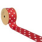 Red & white polka dot grosgrain ribbon on spool, partially unrolled 