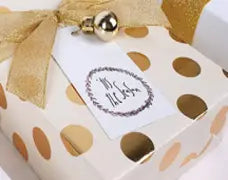 30" x 10' Wrapping Paper Features an ivory background adorned with stylish gold polka dots