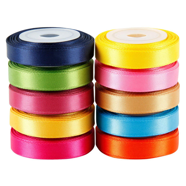 Stack of multi color assorted satin ribbon spools